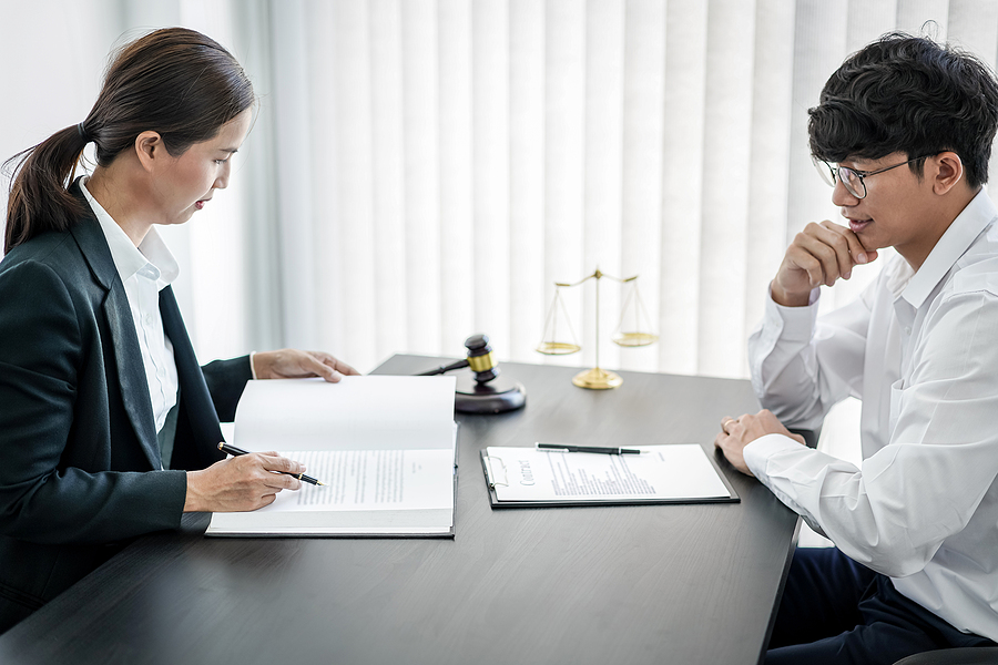 lawyer trying to help client understand why bankruptcy is helpful.