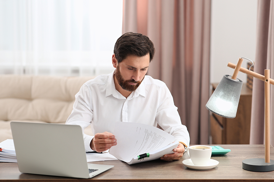 Businessman working with documents for Small Business Debt Relief